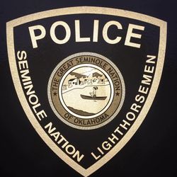Picture of a police badge logo with the Seminole Nation logo in the middle of it. It says:
SEMINOLE NATION LIGHTHORSEMEN POLICE